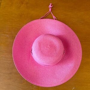 Pink floppy gardening or beach hat with tie.